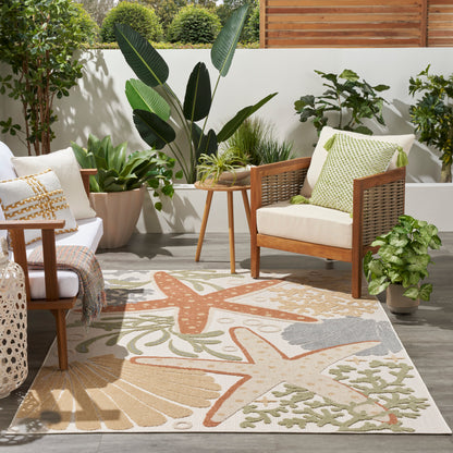Outdoor rug with a botanical pattern on a patio.