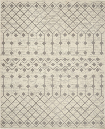 Beige area rug with taupe geometric diamond lattice and diamond-row motifs; modern chic.