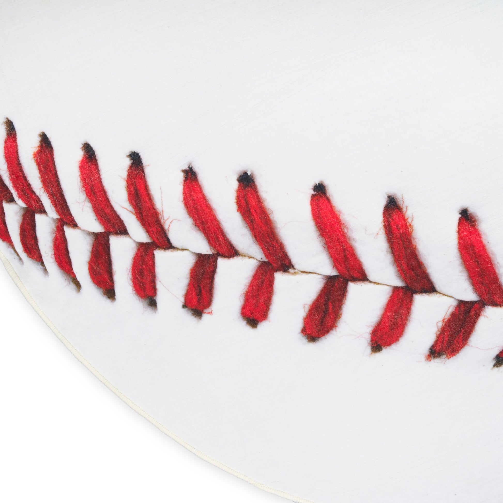 Close-up of white textured rug fibers, showing a soft plush surface.