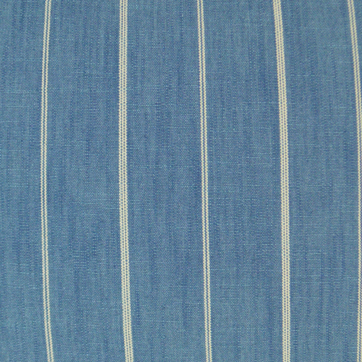 Blue pillow with white vertical stripes and a denim-like weave; 24" x 24" home decor pillow.