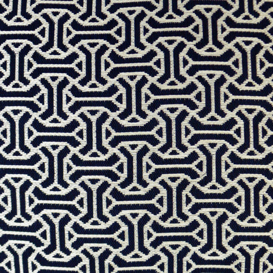 Navy fabric featuring a white interlocking geometric chain pattern in a repeating motif.