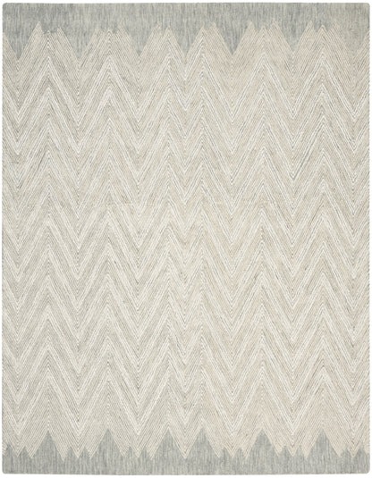 Rectangular woven rug with beige chevron zigzags and gray-blue borders at the top and bottom, soft, textured design.