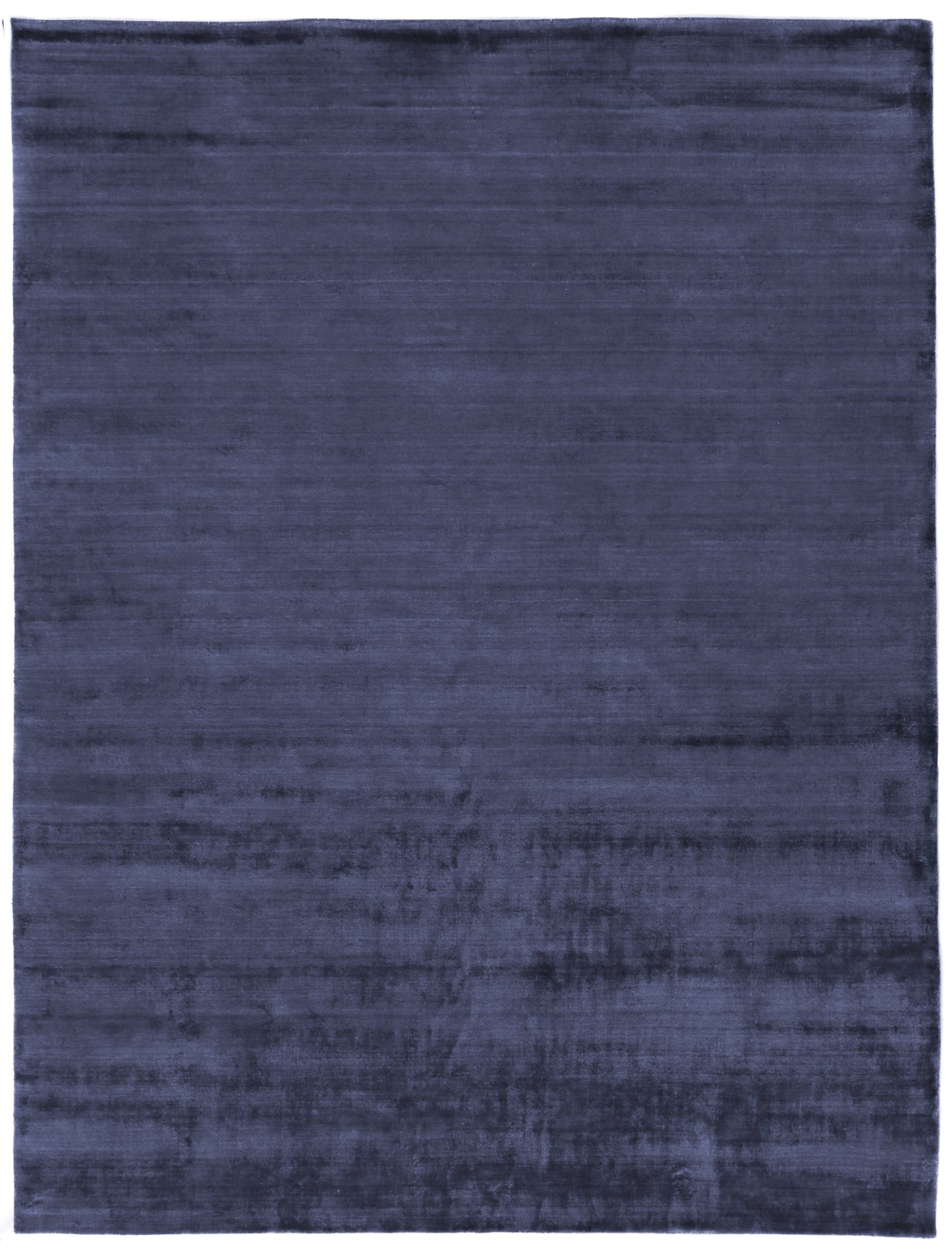 Navy blue rectangular rug with plush velvet-like pile and subtle tonal variation.