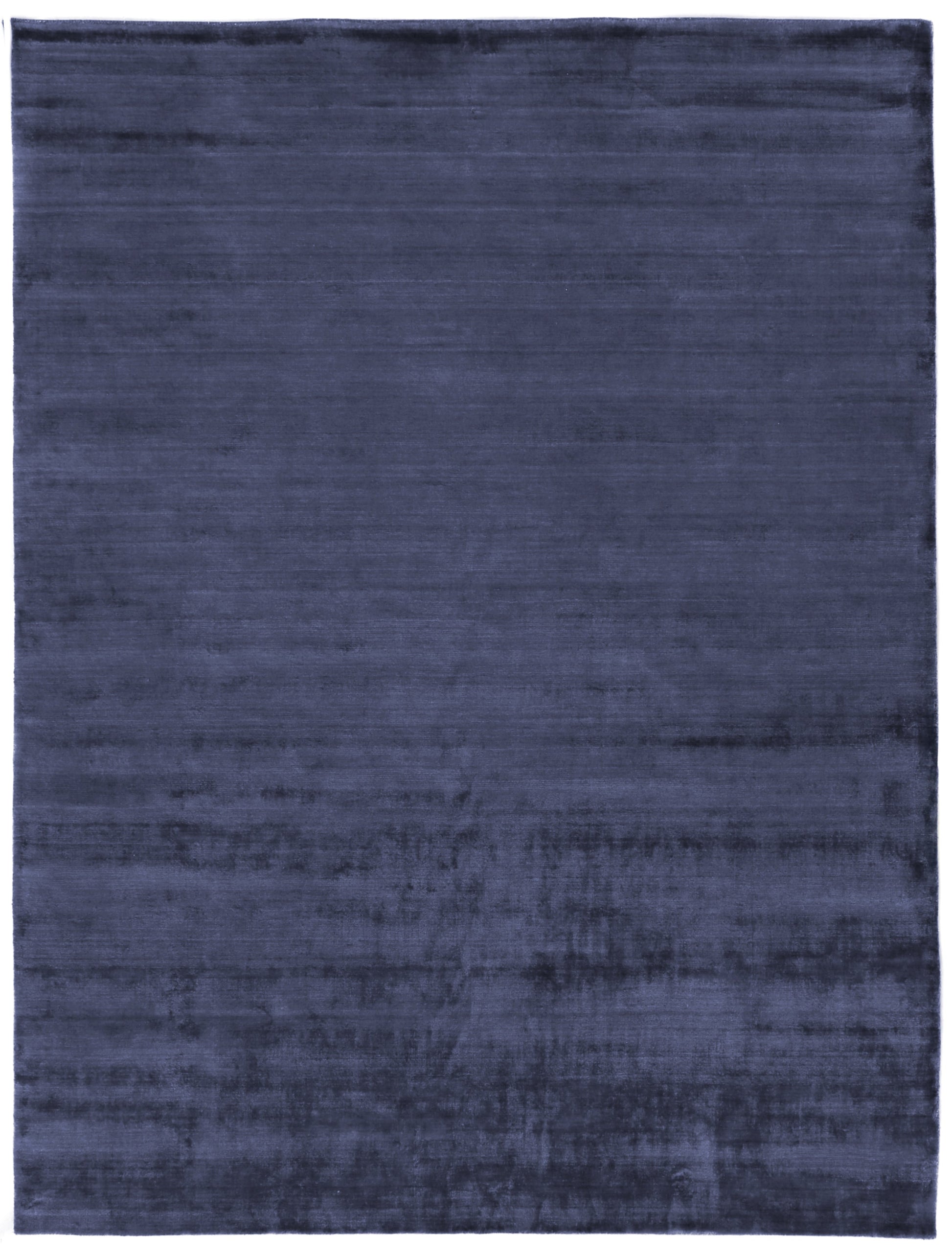 Navy blue rectangular rug with plush velvet-like pile and subtle tonal variation.
