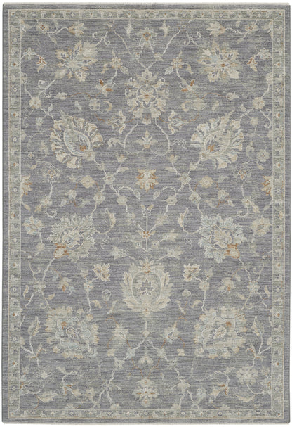 Muted gray-blue traditional floral area rug with ivory/cream & light gold accents, ornate border, woven texture.
