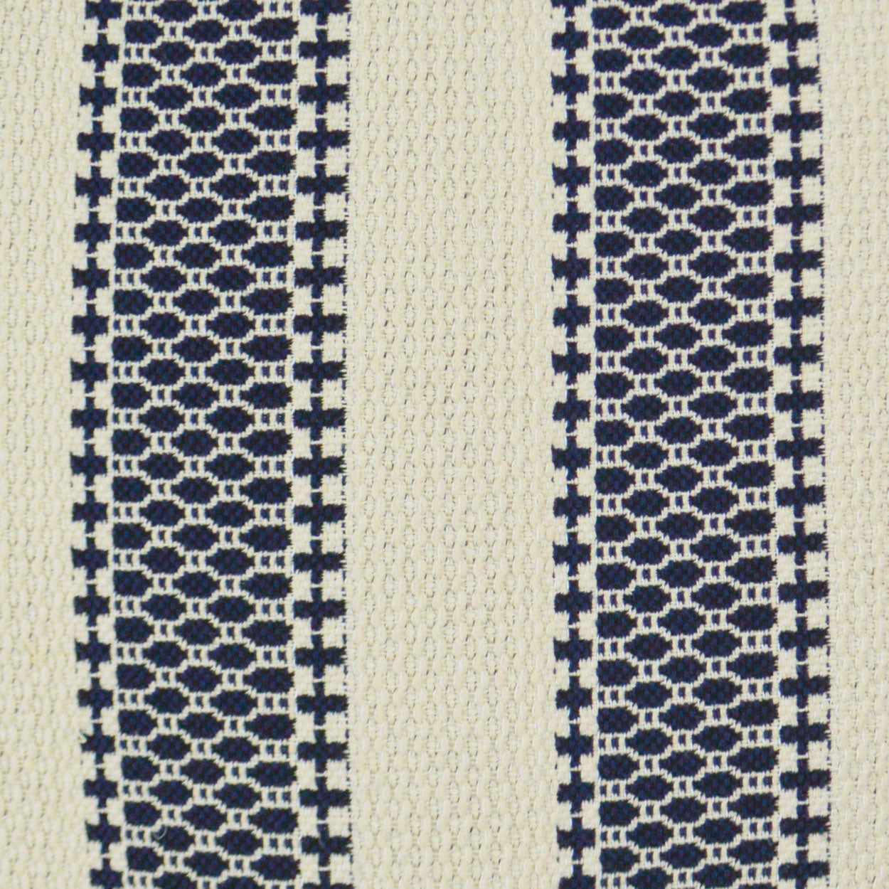 Striped woven fabric with navy lattice panels and a central cream stripe; geometric, textured textile for upholstery.