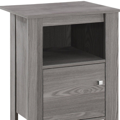 Gray wood end table with square top, open middle shelf, and front drawer with a small square knob.