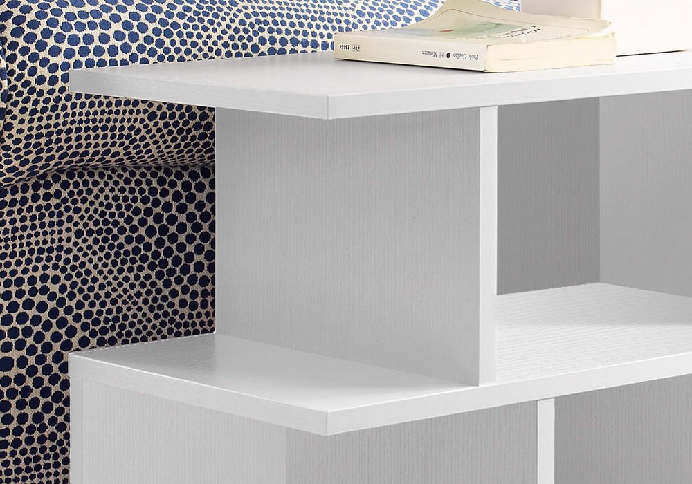 White painted wooden end table with six open shelves; modern minimalist design, books on top.