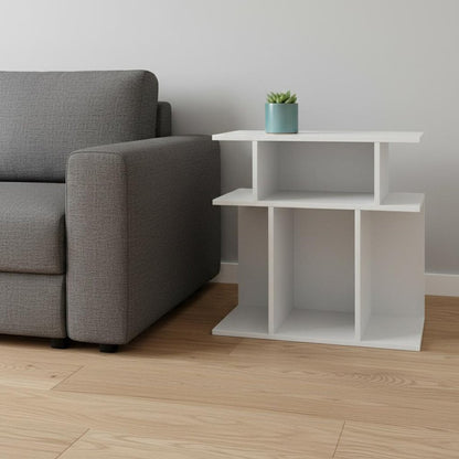 White wood end table with six open shelves beside a gray fabric sofa; small potted plant on top.