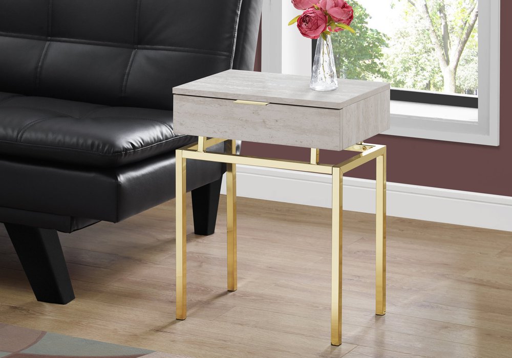 Rectangular beige wood end table with a single drawer on gold metal legs, modern living-room accent.