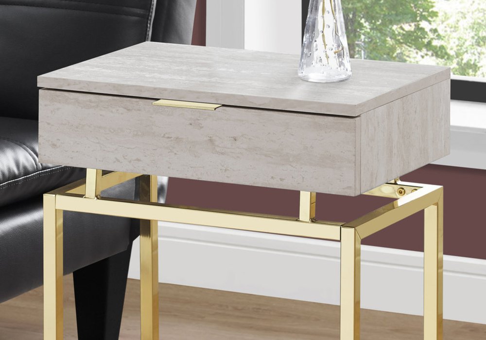 Beige wood-top end table with a single drawer on a gold metal frame, glass vase on top.