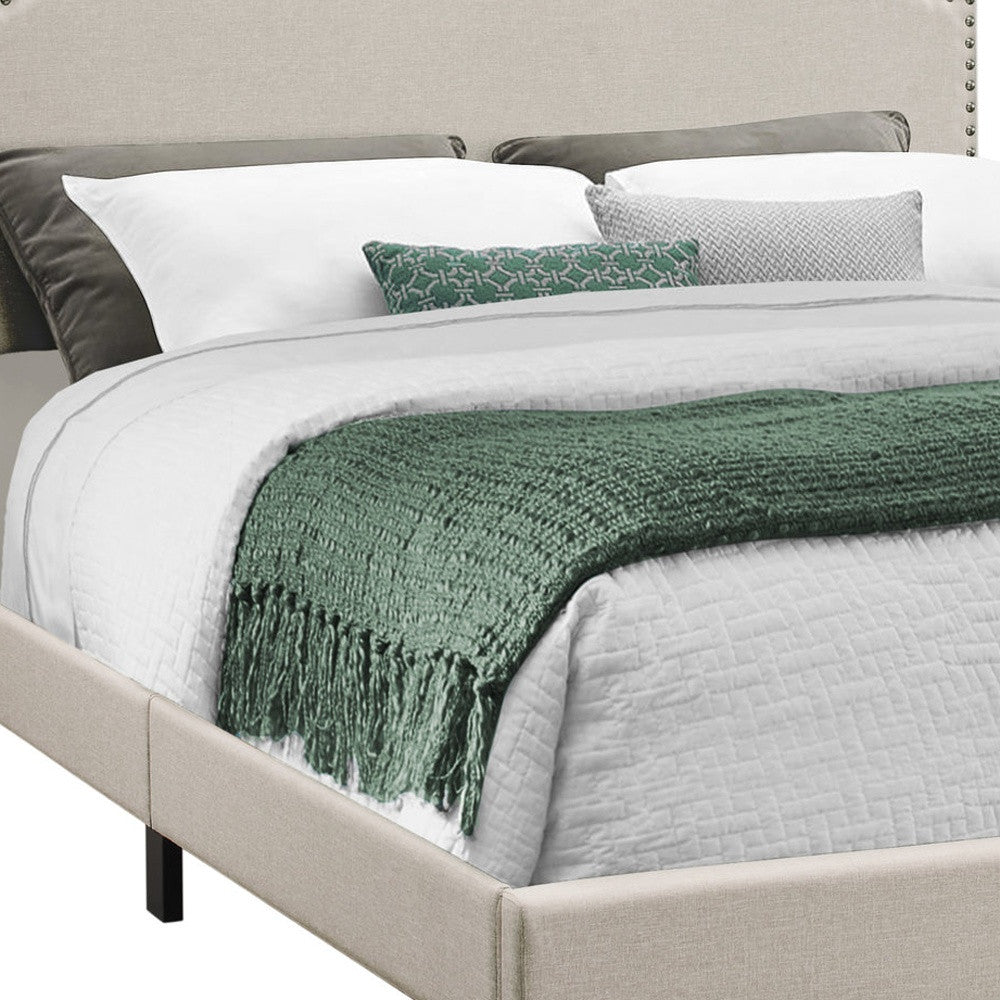 Gray Standard Bed Upholstered With Nailhead Trim And With Headboard