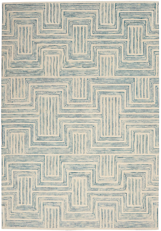 Blue and cream area rug featuring a geometric, interlocking stepped-square pattern with a textured weave.