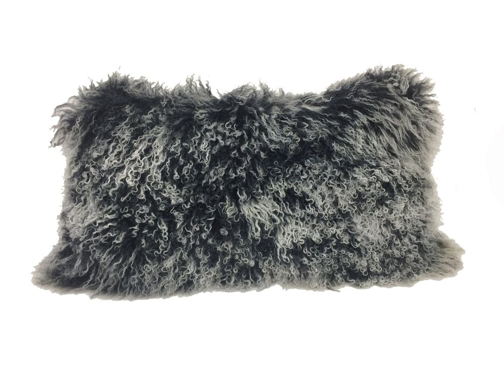 Rectangular black genuine Tibetan lamb fur pillow with microsuede backing, 17 inches.