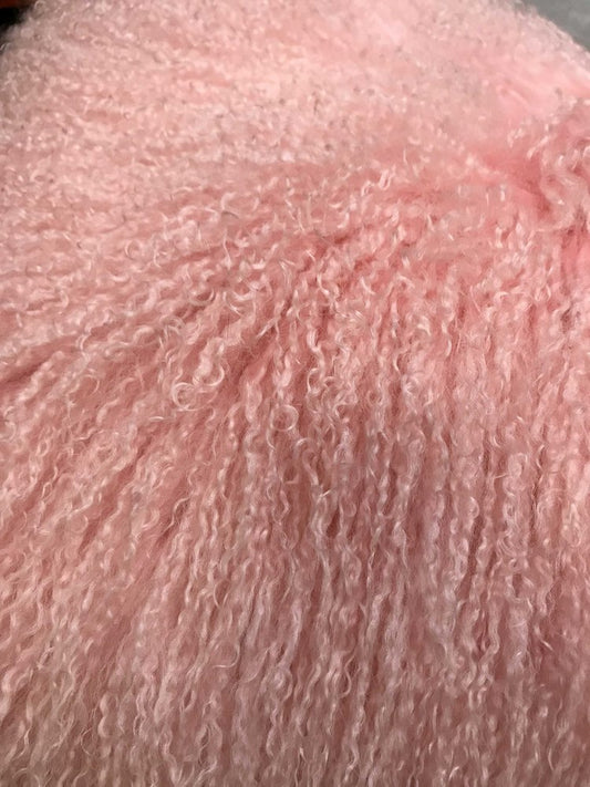 Soft pink plush terry fabric with curly loops; cozy towel or robe texture.