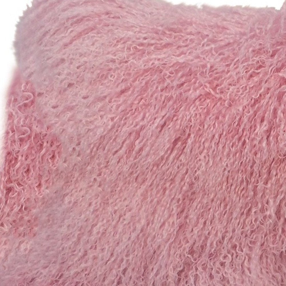 Close-up of soft pink plush pillow fabric with curly boucle texture on a 15x25 inch lumbar throw pillow.