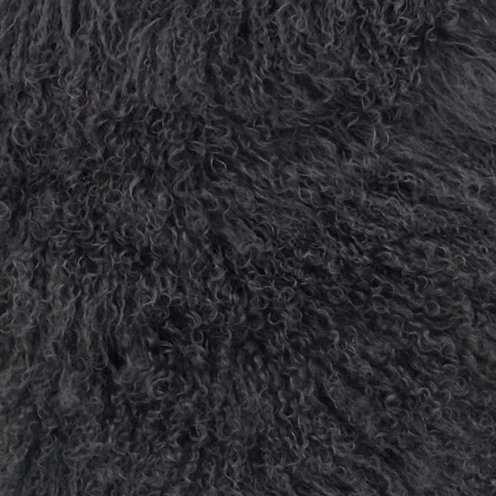 Close-up of dense charcoal genuine Tibetan lamb fur, plush and curly.