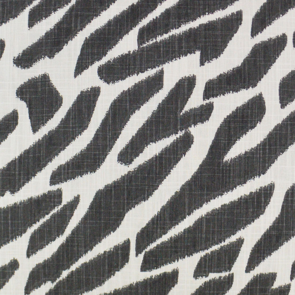 Black and white zebra-stripe fabric with a subtle woven texture, bold animal-print material for upholstery or apparel.
