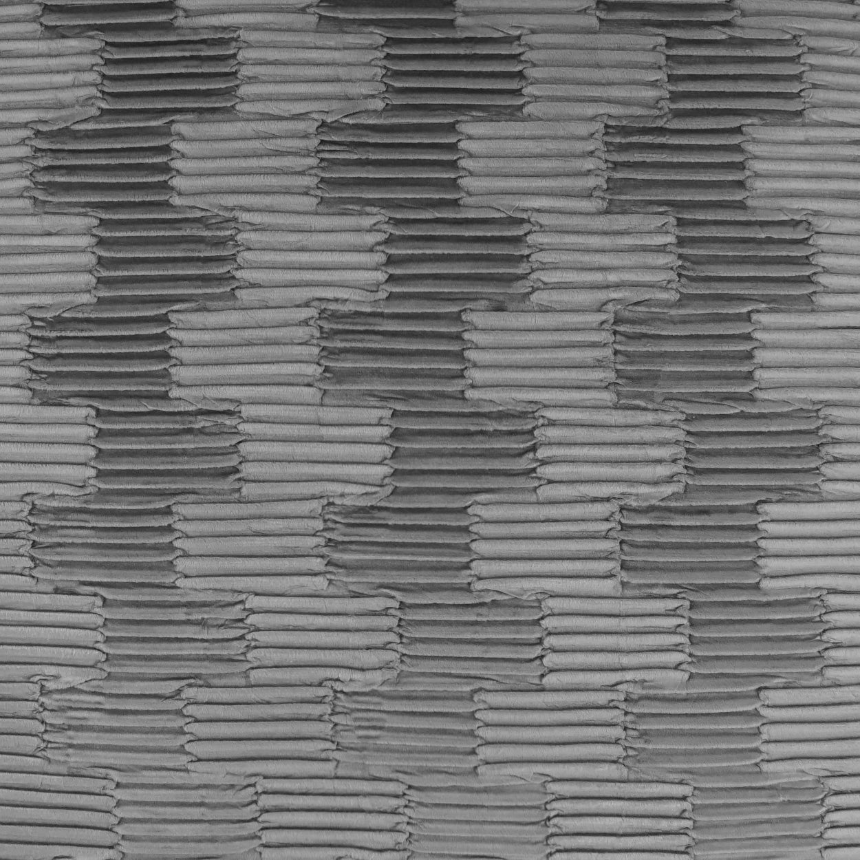 Gray woven fabric texture with ribbed rectangular blocks; industrial textile look for upholstery