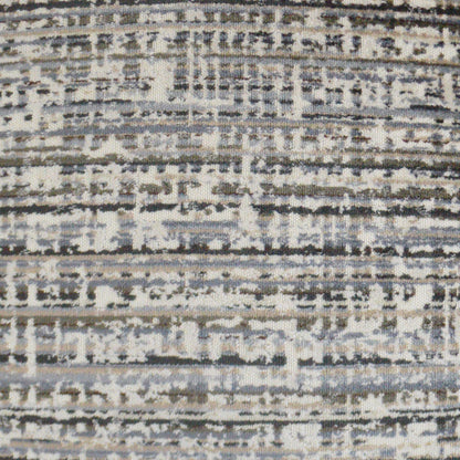 Abstract striped woven rug in grey, cream, and blue tones with a distressed pattern.