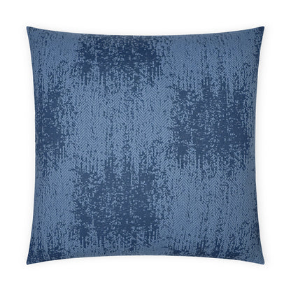 Square decorative pillow in navy and light blue with a textured jacquard abstract pattern.