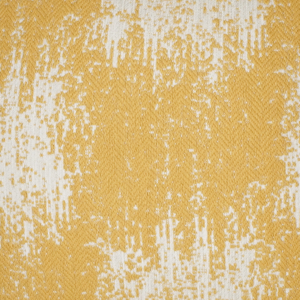 Close-up of yellow and white speckled woven fabric with an abstract brushed pattern on a 24" x 24" pillow.