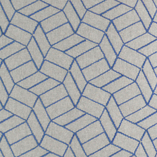 Gray fabric rug with blue outlined 3D cube geometric pattern.