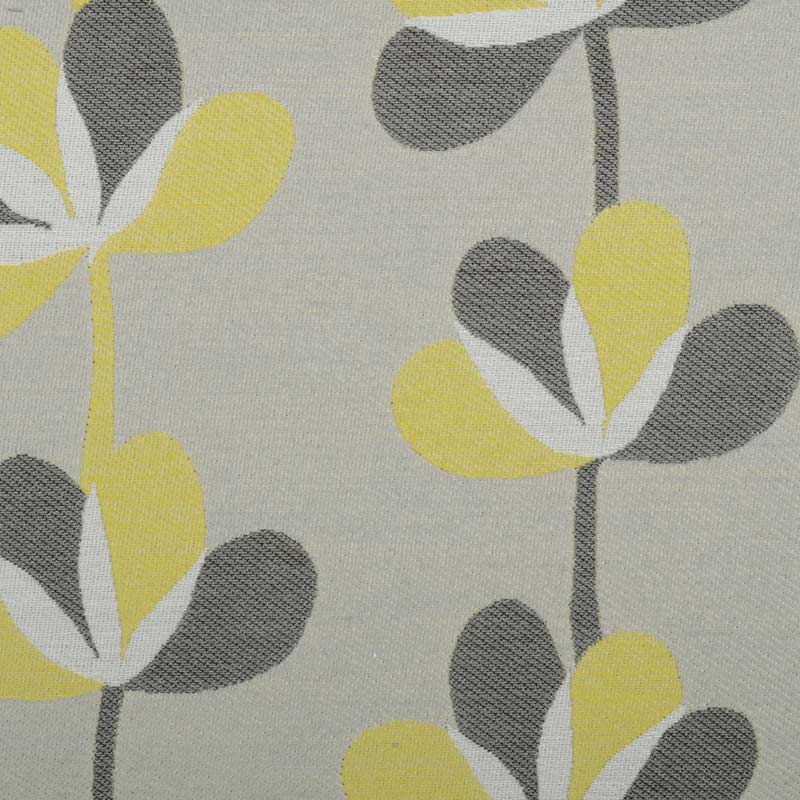 Abstract floral pattern with yellow and gray petals on a pale gray background and dark stems.