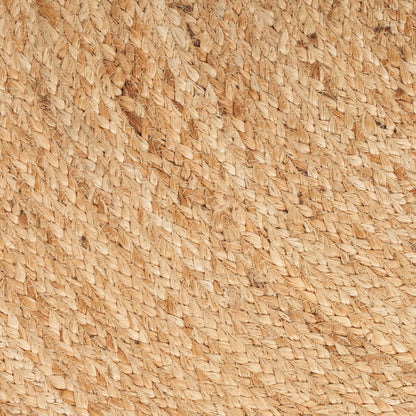 Close-up of natural beige straw fibers woven in a diagonal pattern, rustic textured material.