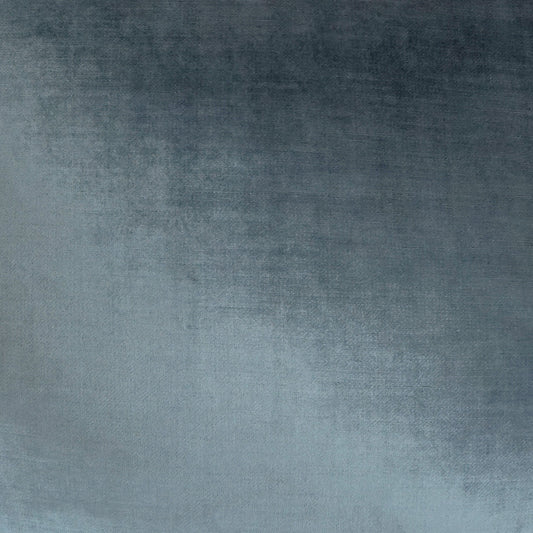 Blue gradient velvet-like fabric texture, dark navy at top fading to light blue, soft woven surface.