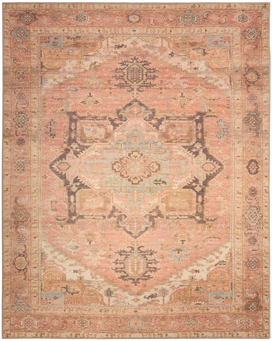 Persian-style vintage rug in peach and pink with ivory central medallion, blue accents, and ornate floral border.