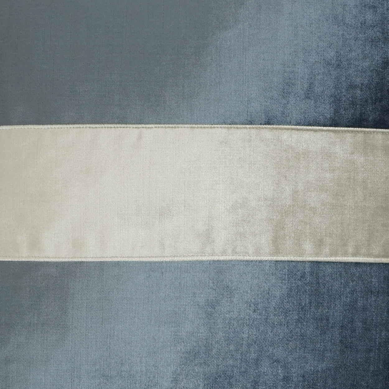Blue-gray velvet with a wide cream-beige horizontal band; soft sheen, upholstery fabric.