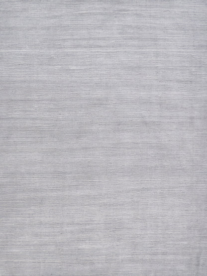 Light gray rug with a subtle textured surface and neutral modern look.