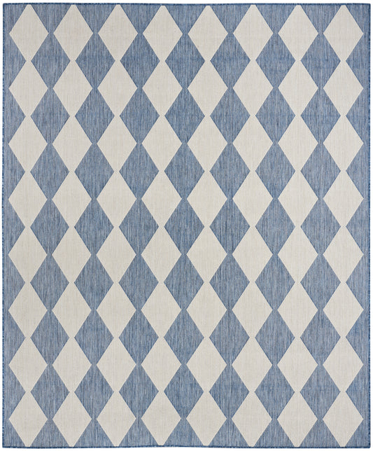 Rectangular blue and ivory diamond-pattern rug with repeating harlequin diamonds for modern living room decor.