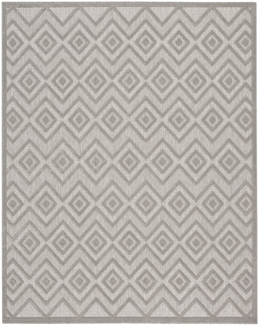 Neutral gray geometric area rug with interlocking diamond pattern; woven texture, contemporary style for living room.