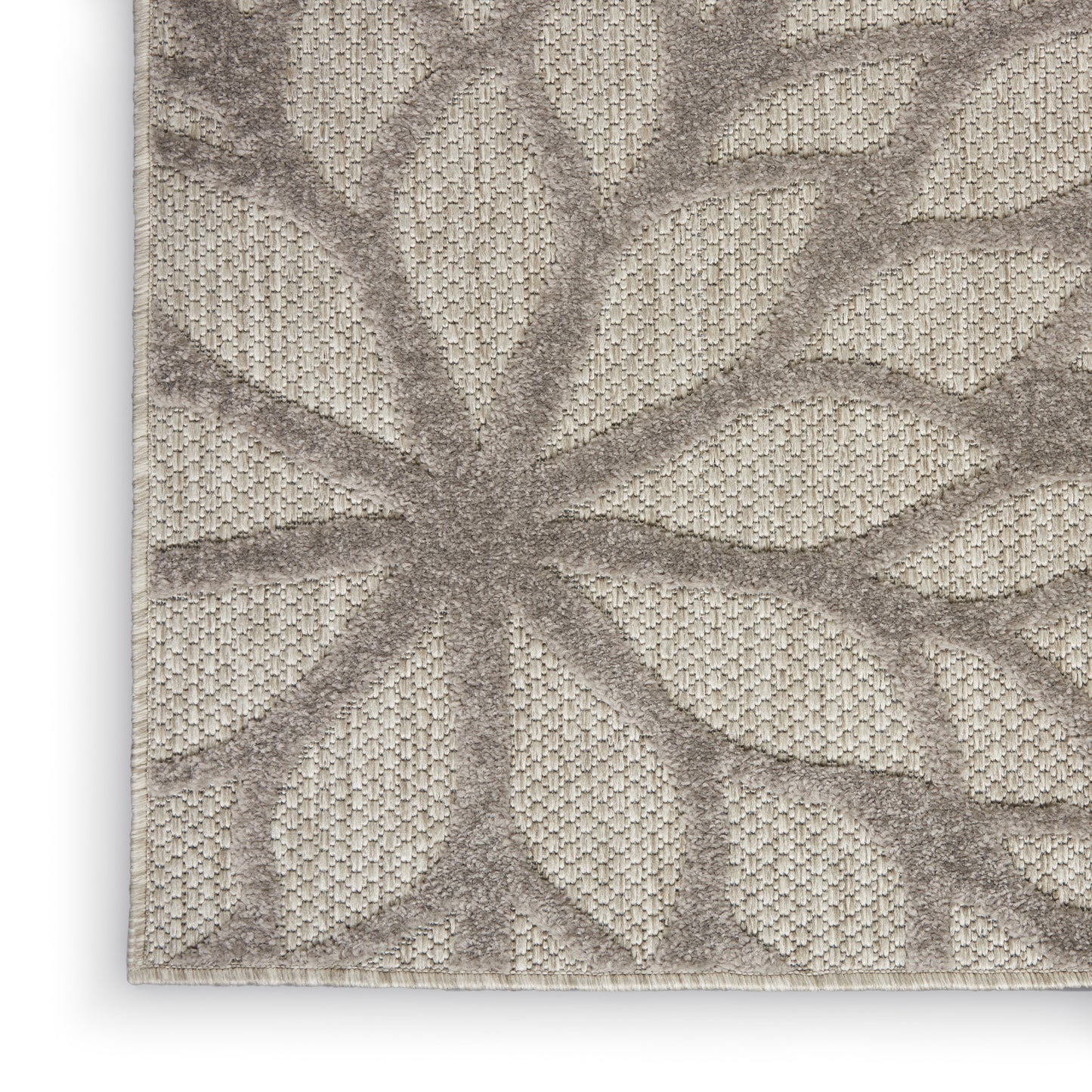Neutral beige tropical runner rug with taupe leafy palm-frond pattern and textured woven surface, 6' long.