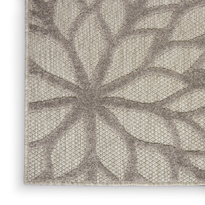 Neutral beige tropical runner rug with taupe leafy palm-frond pattern and textured woven surface, 6' long.