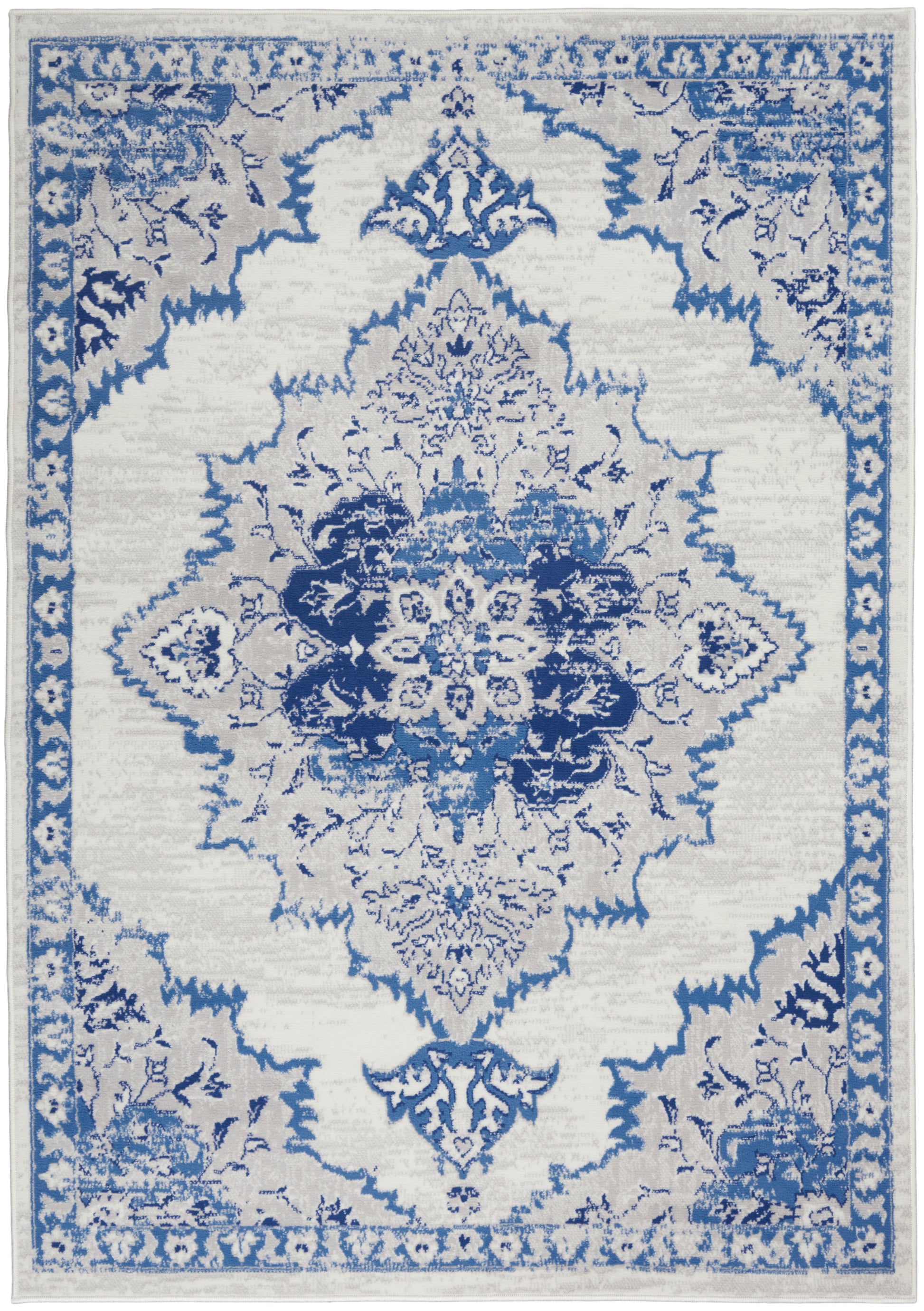 Blue and white oriental rug with intricate central medallion and floral borders, rectangular decorative floor accent.