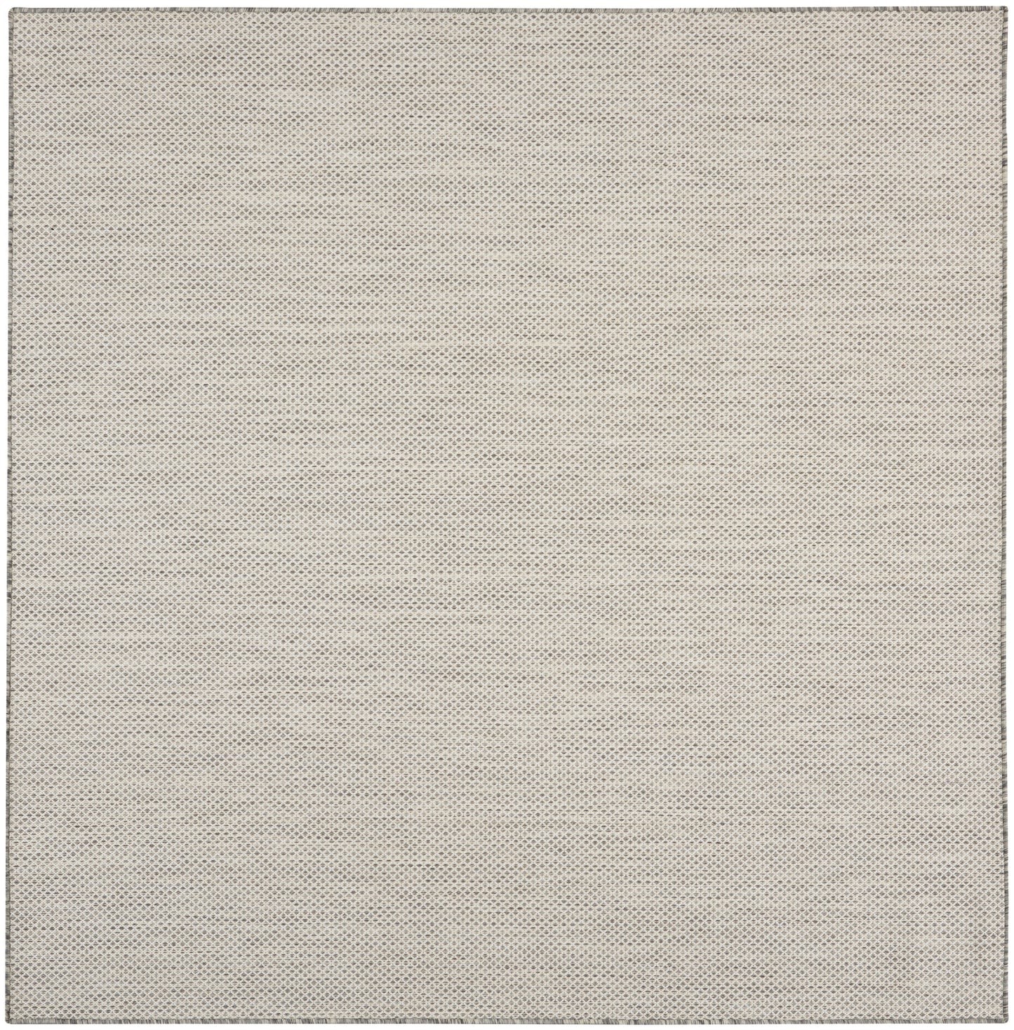 Beige rug with tiny grey dotted pattern, square shape, soft woven texture.
