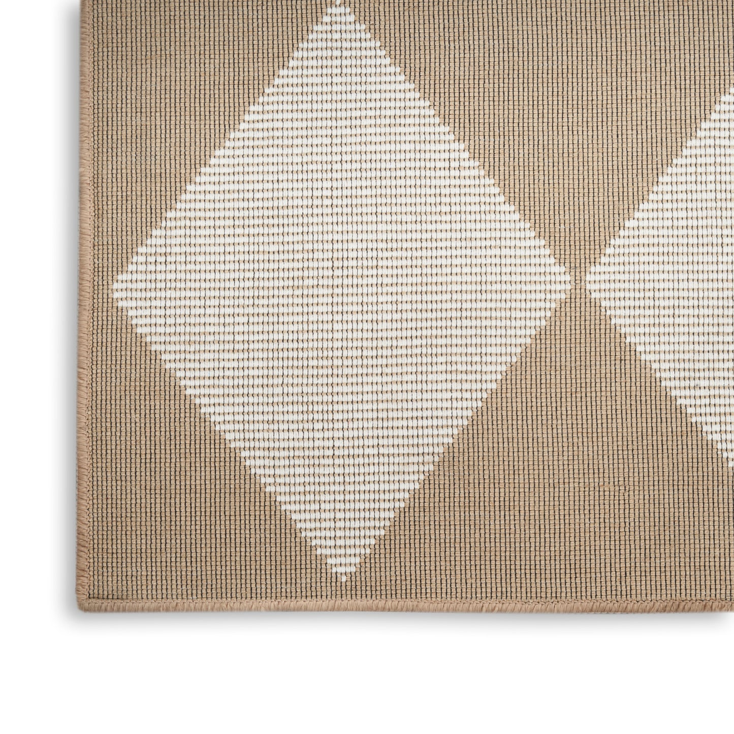Natural beige woven rug with white diamond pattern and textured surface.