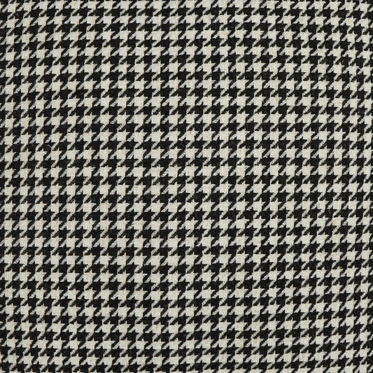 Close-up of black & white houndstooth fabric; woven textile pattern ideal for suits or coats.