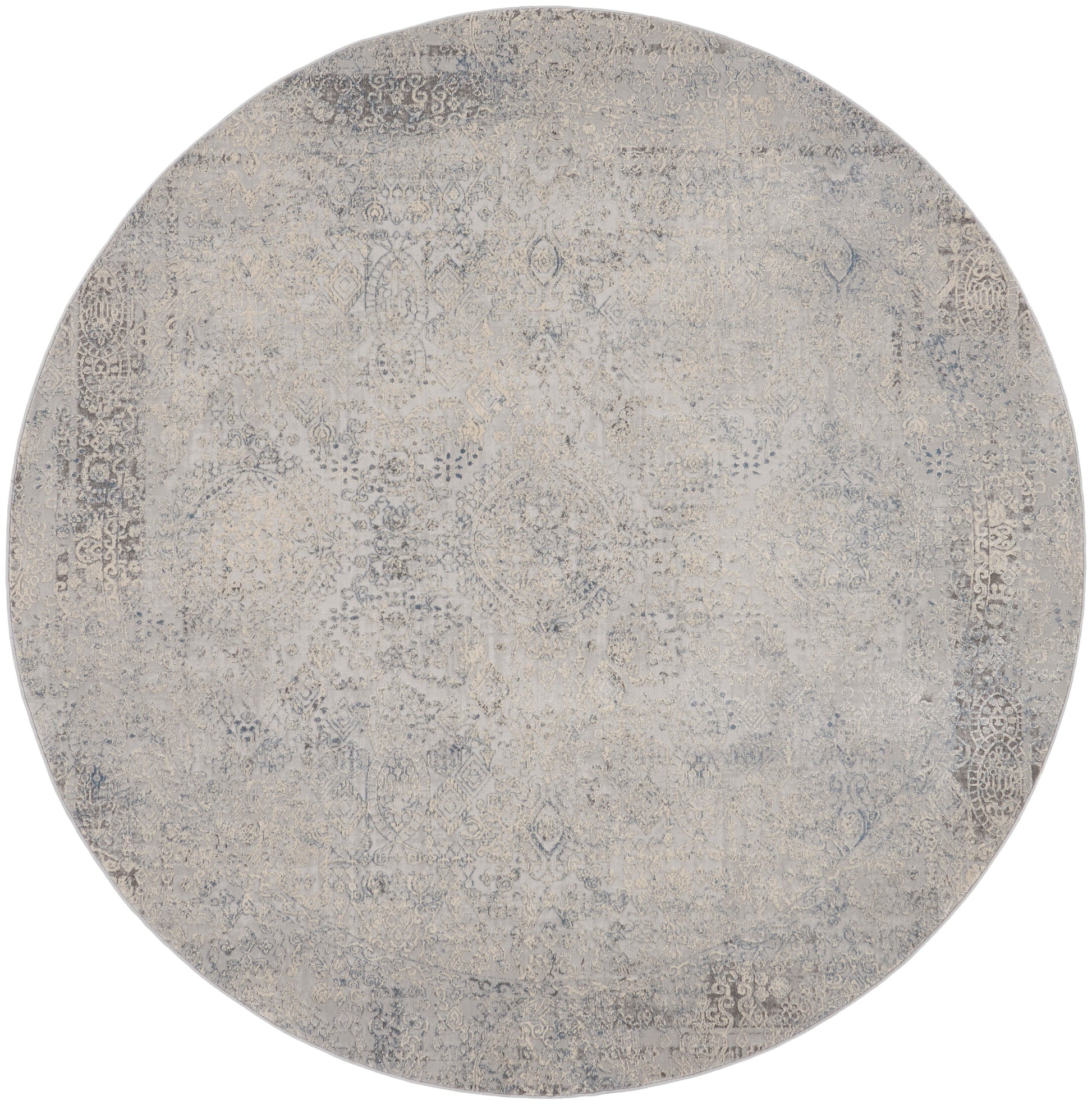 Round distressed rug in beige & gray tones with an ornate faded pattern; vintage Persian-inspired style.
