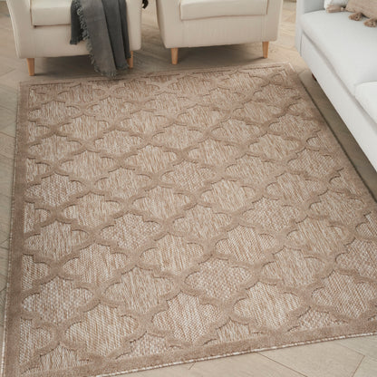 Beige woven area rug with taupe trellis pattern; textured, neutral living room style.