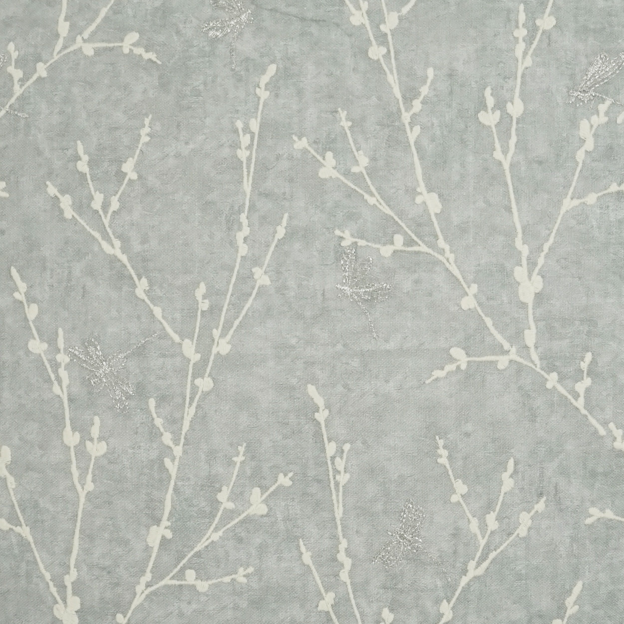 Gray-blue fabric with white twig botanical pattern; soft, versatile upholstery & drapery material.