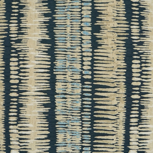 Ikat-inspired striped fabric with beige and light blue dashes on a dark navy background; woven upholstery textile.