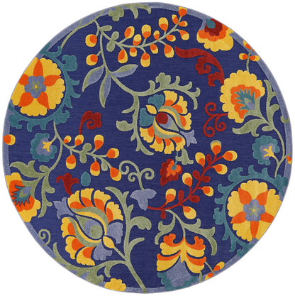 Round rug with navy blue base and vibrant yellow, orange and green floral vine pattern.
