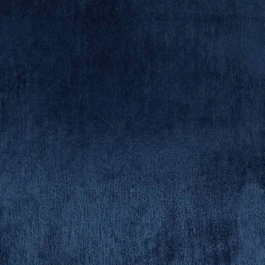Dark blue velvet fabric close-up with soft pile and rich texture.