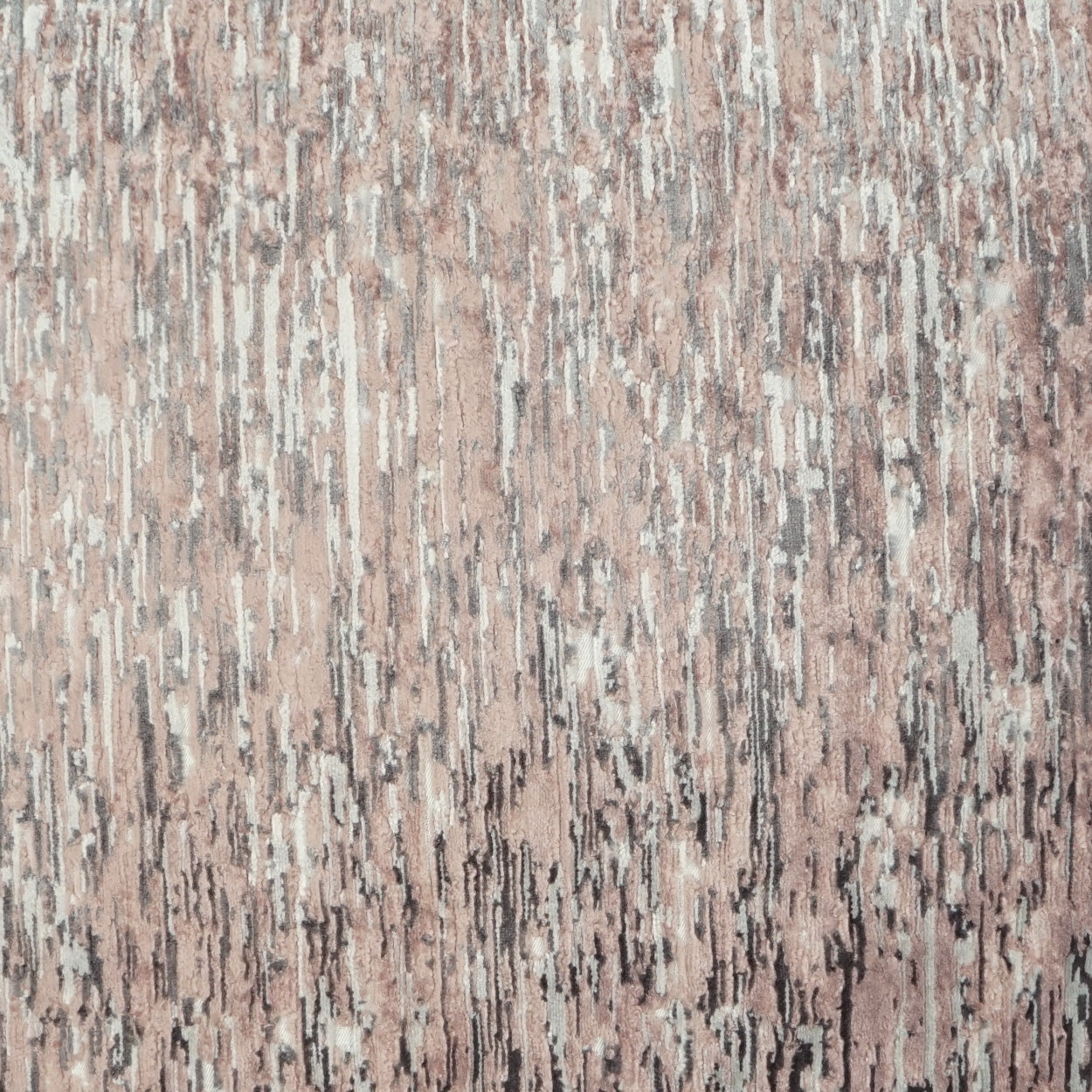 Pink-beige fabric with irregular gray vertical streaks; textured upholstery textile with subtle metallic sheen.