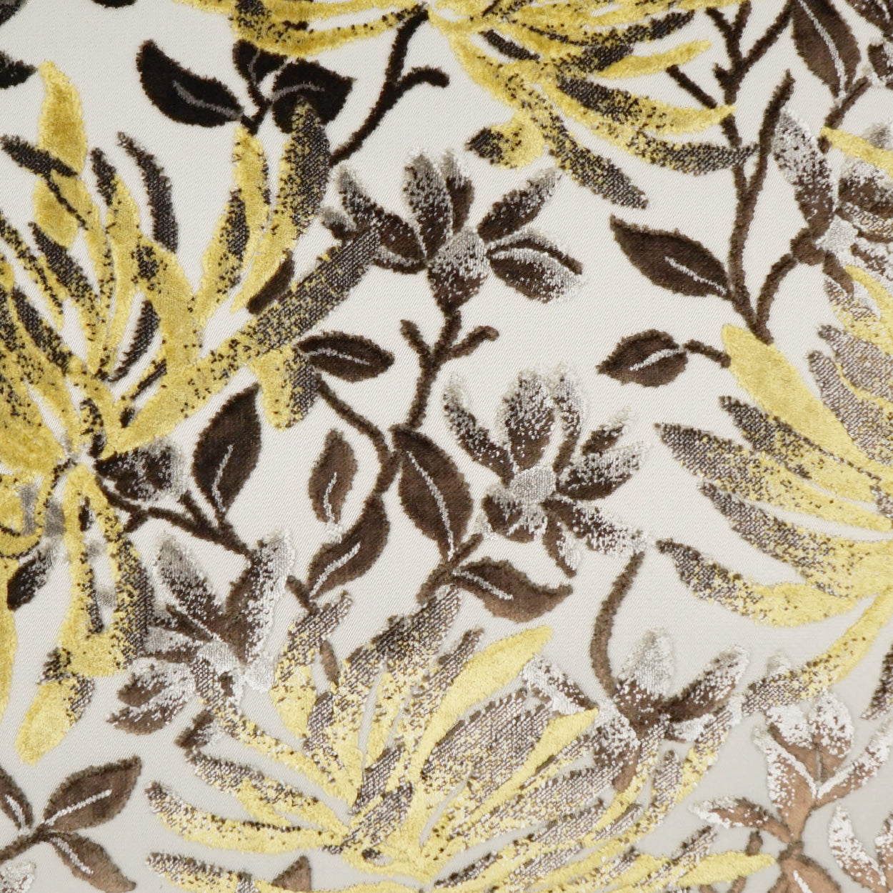 Fabric with metallic gold, bronze and brown leaves in a dense botanical print.