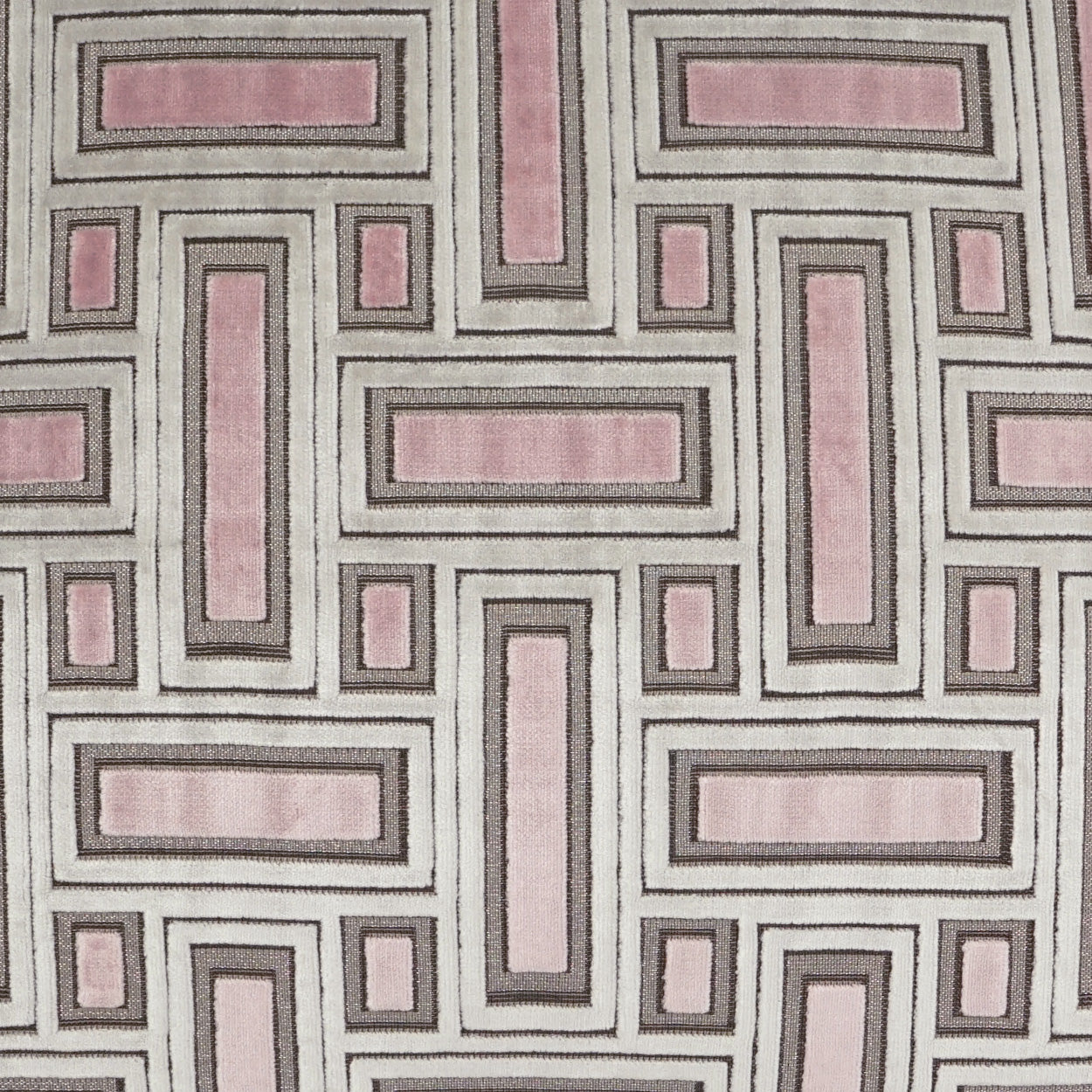 Geometric fabric pattern with soft pink rectangular blocks outlined by gray borders in a maze-like grid.